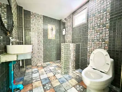Charming bathroom with colorful mosaic tiles and modern fixtures