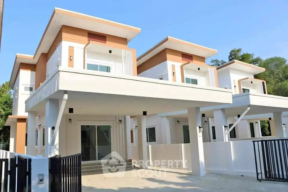 Modern two-story house with sleek design and spacious driveway