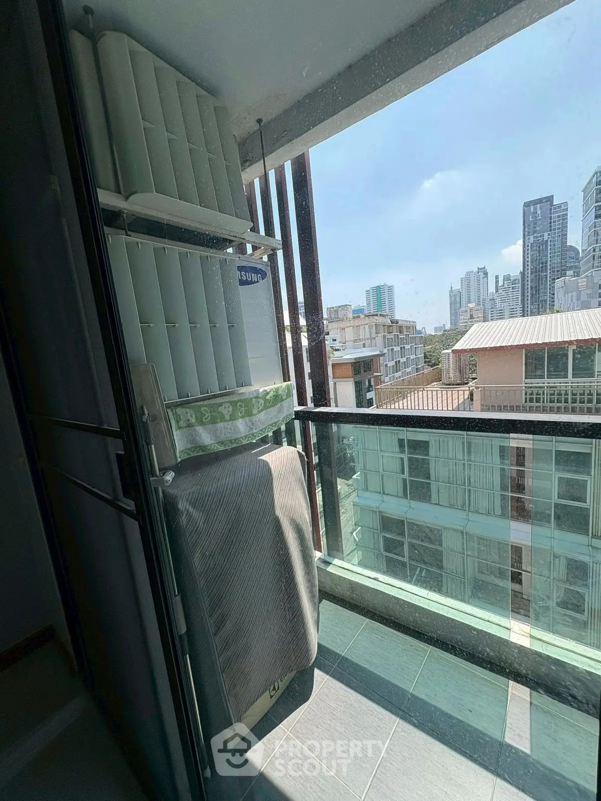 Charming balcony with city view, perfect for relaxation and enjoying urban skyline.
