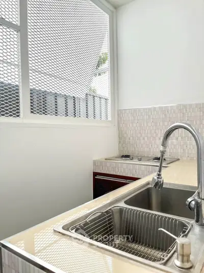 Modern kitchen with sleek sink and minimalist design