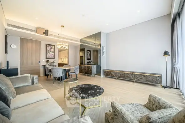 Luxurious modern living room with elegant decor and ample natural light.