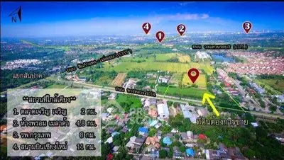 Aerial view of a real estate plot with nearby landmarks and roads highlighted.