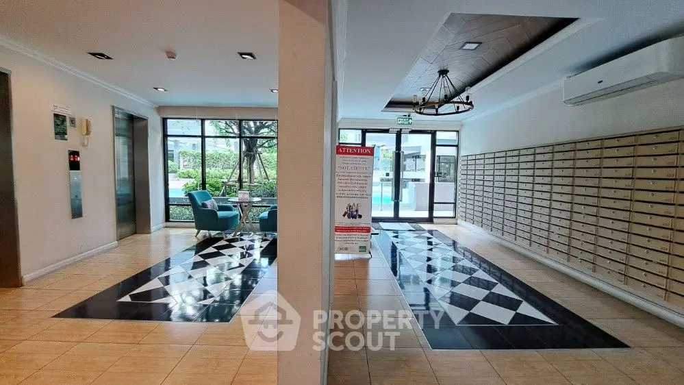 Elegant apartment lobby with stylish flooring and mailboxes