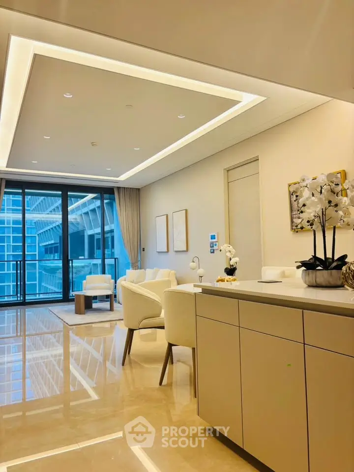 Luxurious modern living room with elegant decor and stunning city view from large windows.