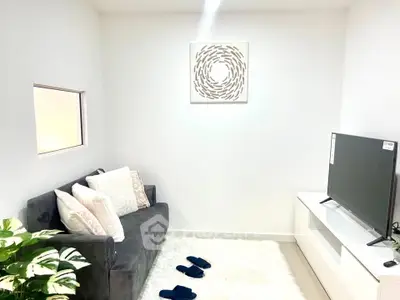 Cozy living room with modern decor and plush seating