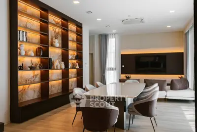 Luxurious modern living room with elegant dining area and stylish shelving.