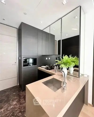 Modern kitchen with sleek cabinetry and elegant countertop