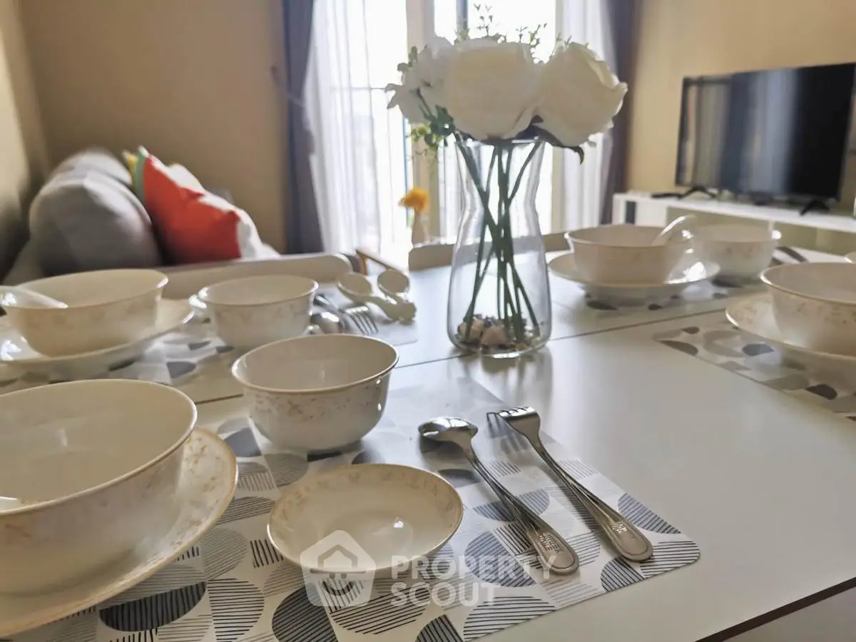 Elegant dining setup in modern living room with cozy ambiance