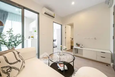 Modern living room with stylish decor and open layout in a bright apartment.