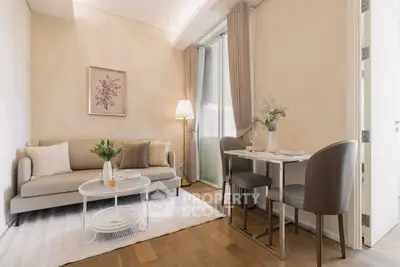 Chic and cozy living room with elegant decor and dining area, perfect for modern urban living.