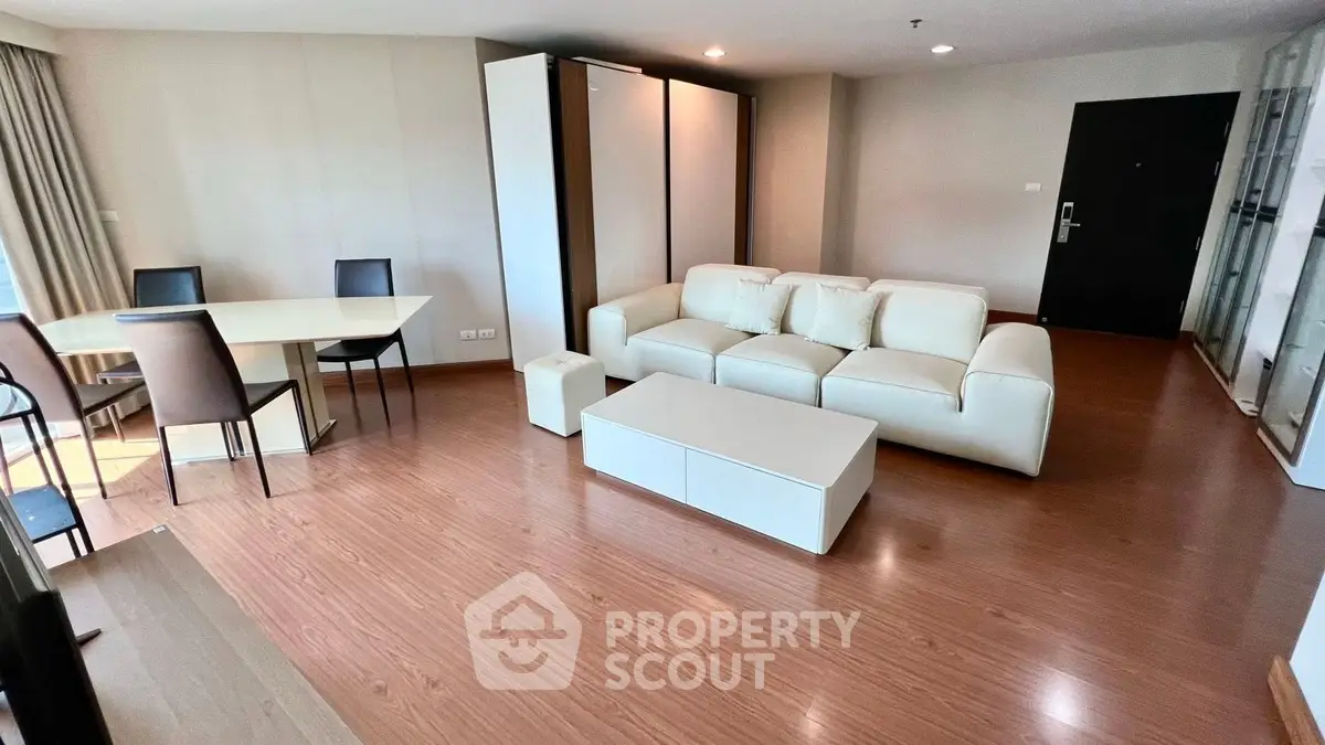 Spacious modern living room with elegant furniture and wooden flooring