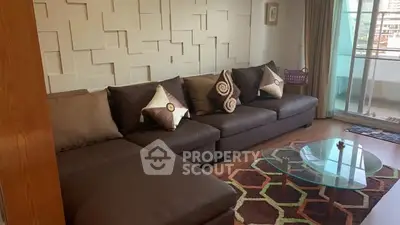 Stylish living room with modern decor and balcony access