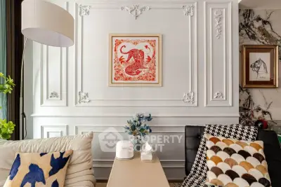 Elegant living room with stylish decor and modern furniture, featuring a chic wall art centerpiece.