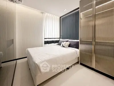 Modern bedroom with sleek design and ample natural light