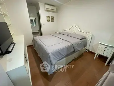 Cozy bedroom with elegant white furniture and modern decor