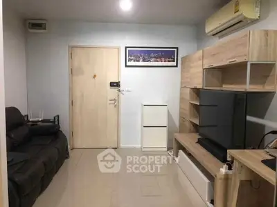 Modern living room with sleek furniture and wall-mounted air conditioner