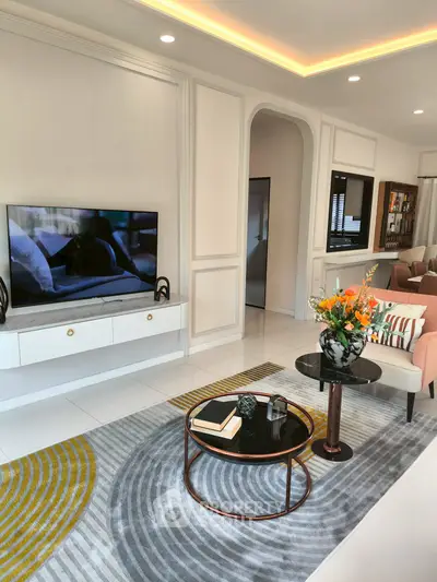 Luxurious living room with modern decor, stylish furniture, and elegant lighting, perfect for relaxation and entertainment.