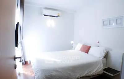 Cozy bedroom with modern decor and natural light