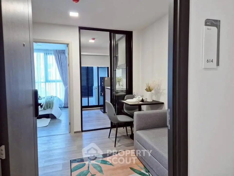 Modern apartment interior with cozy living room and dining area, featuring stylish decor and natural light.