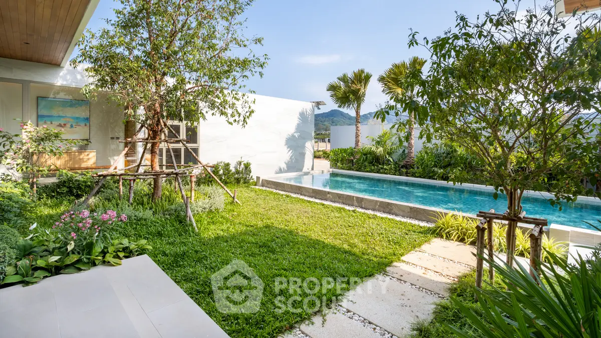 Luxurious modern villa with private pool and lush garden, offering stunning mountain views.