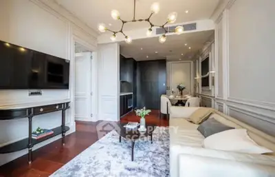 Elegant living room with modern decor and stylish lighting in a luxury apartment.