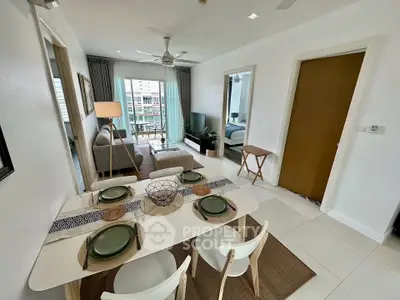Modern living room with dining area and balcony view in stylish apartment