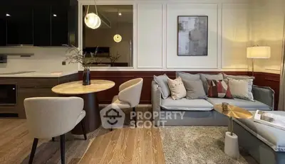 Modern living room with stylish decor, cozy seating, and elegant lighting in a contemporary apartment.