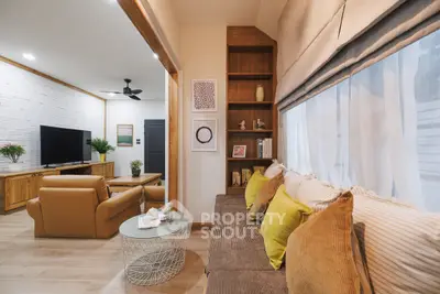 Spacious living room with cozy seating and modern decor