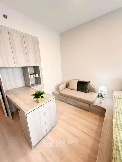 Modern living room with sleek wooden furniture and cozy seating area