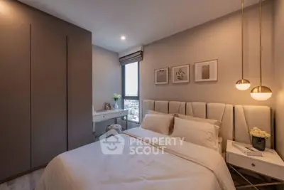 Elegant bedroom with modern decor and city view, featuring stylish lighting and cozy ambiance.