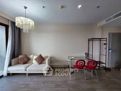 Modern living room with stylish chandelier and cozy seating area