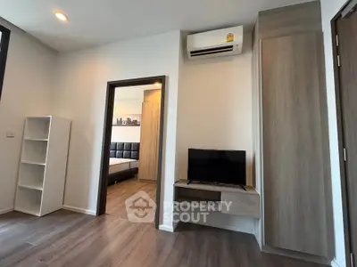 Modern apartment interior with sleek design featuring a cozy bedroom and stylish living area.