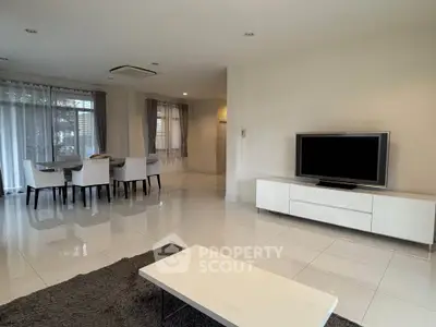 Spacious modern living room with dining area and sleek decor