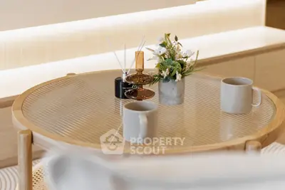 Stylish modern living room with elegant glass coffee table and decor accents