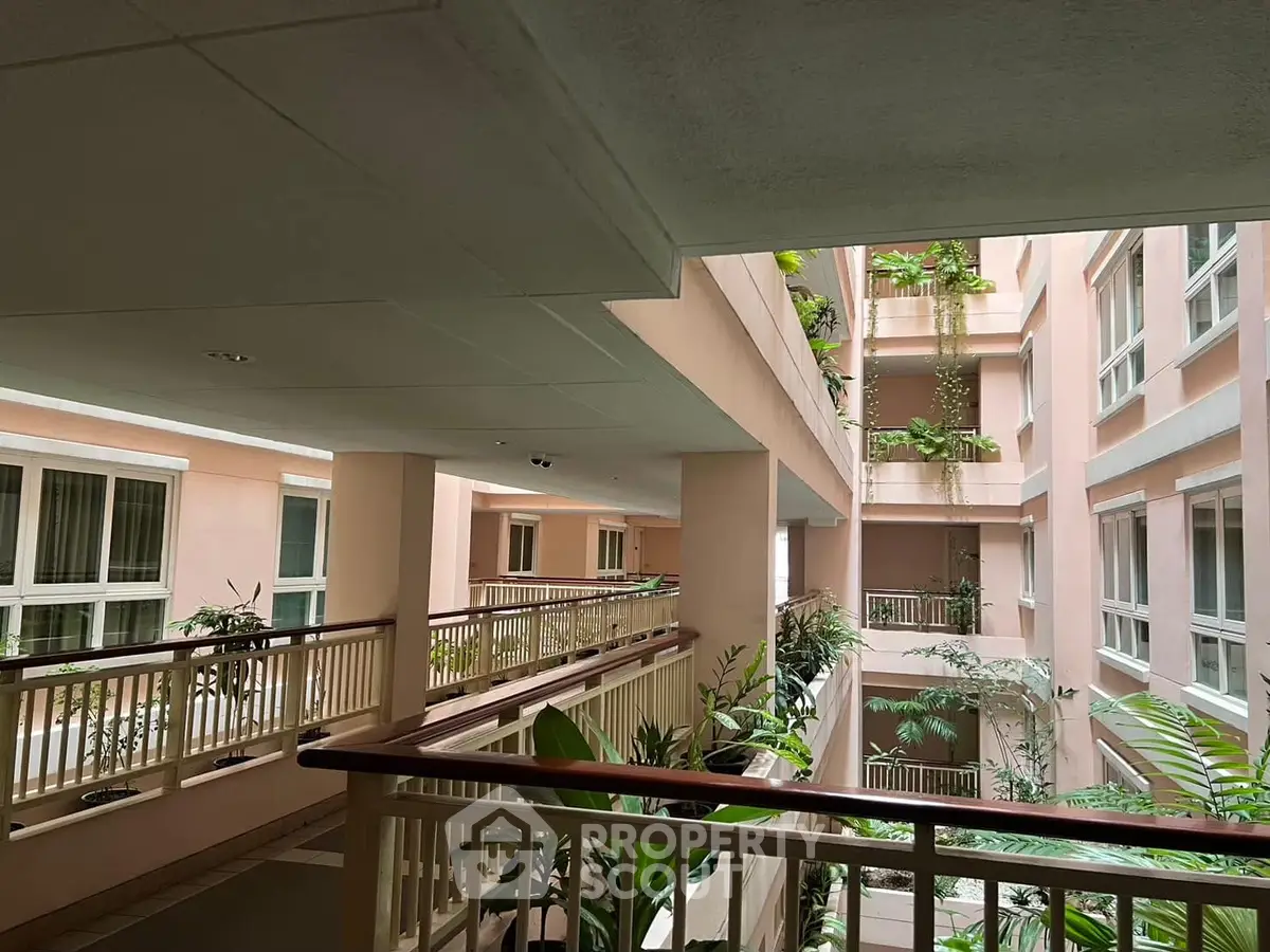 Elegant building interior with lush greenery and modern architecture