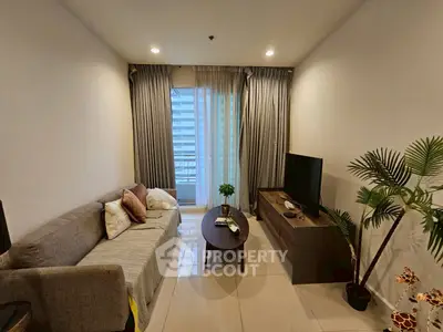 Cozy living room with modern decor and large window view