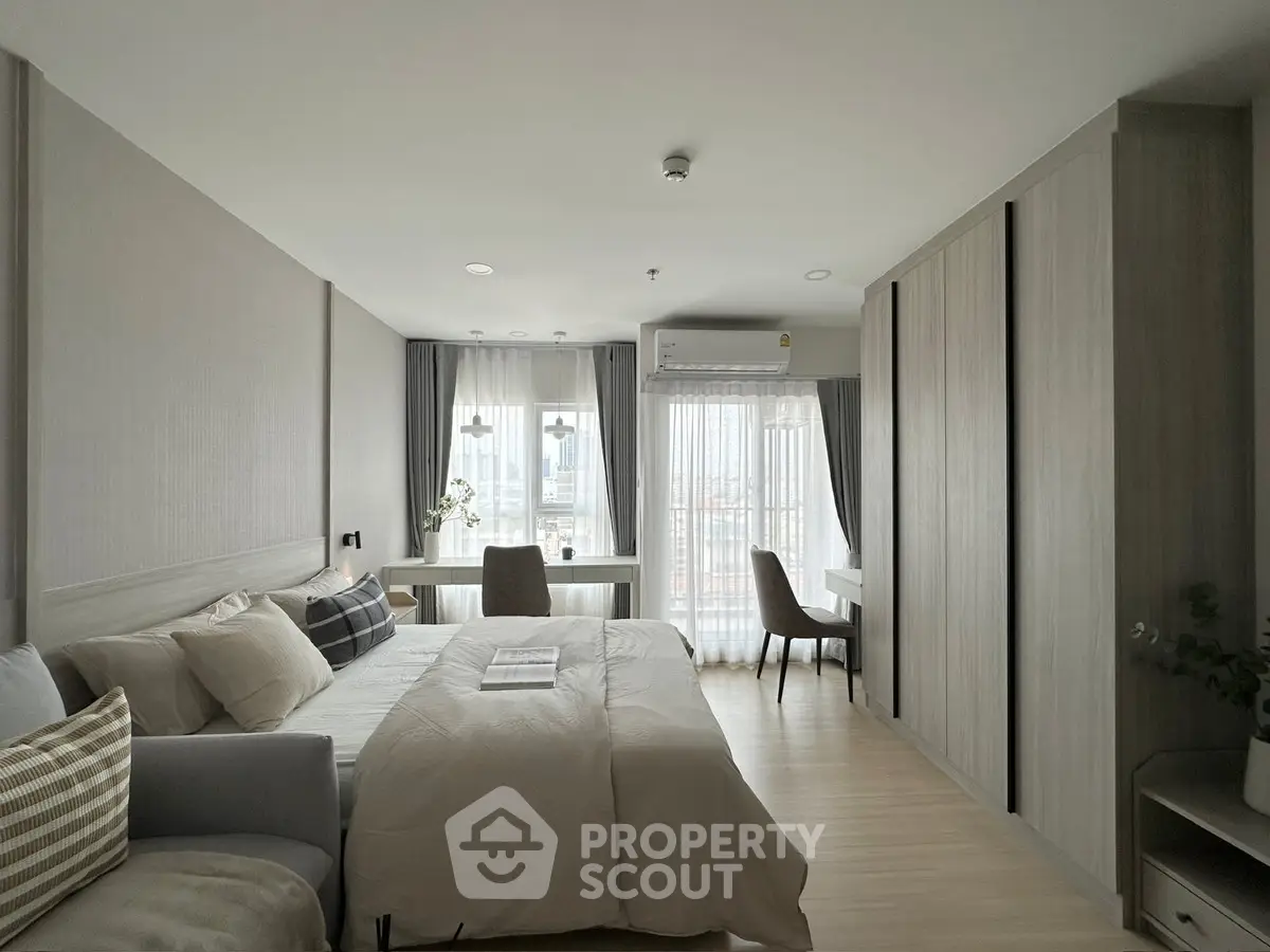 Modern bedroom with cozy decor and natural light in urban apartment