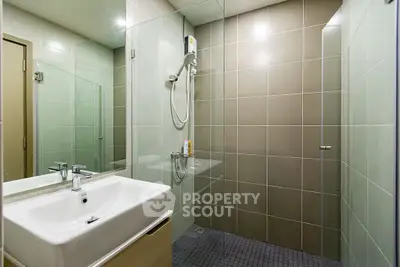 Modern bathroom with sleek glass shower and stylish sink