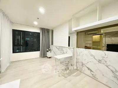 Modern living room with marble accents and city view, featuring sleek design and ample natural light.