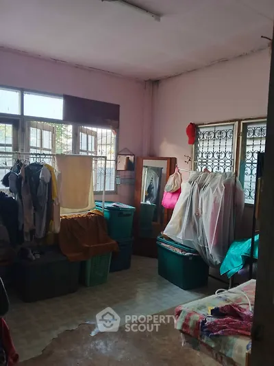 Spacious bedroom with ample storage and natural light, ideal for organizing and relaxing.