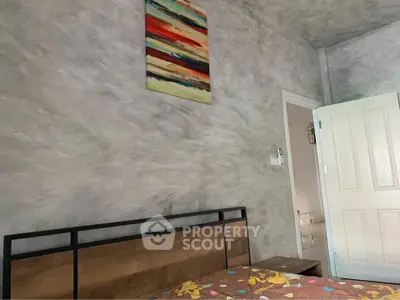 Modern bedroom with abstract art and stylish decor