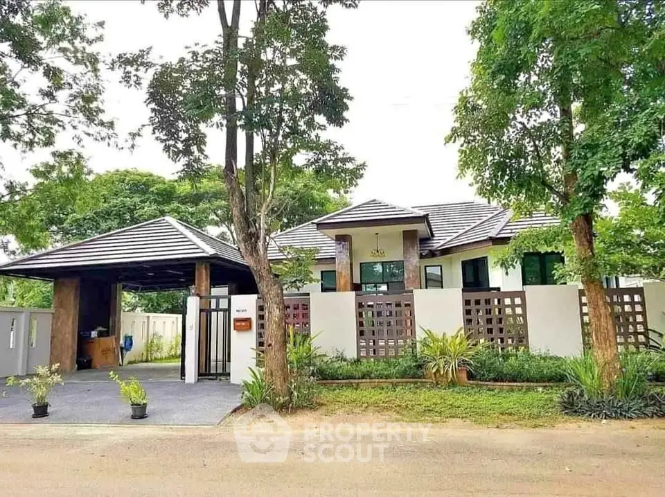 Stunning modern house with lush greenery and spacious driveway, perfect for serene living.