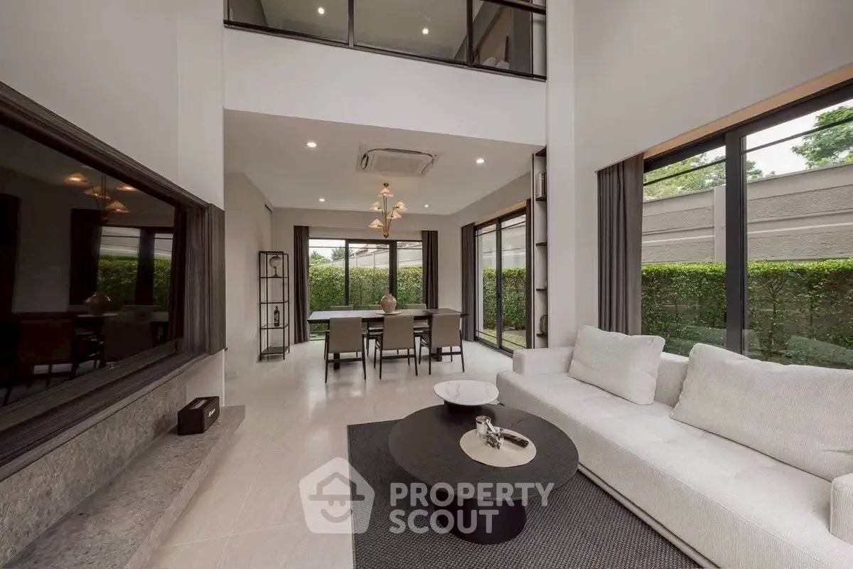 Luxurious modern living room with high ceilings and elegant decor