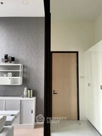 Modern interior with sleek storage and stylish decor in a contemporary living space.