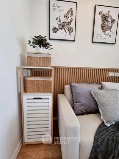 Stylish living room corner with modern decor and cozy sofa