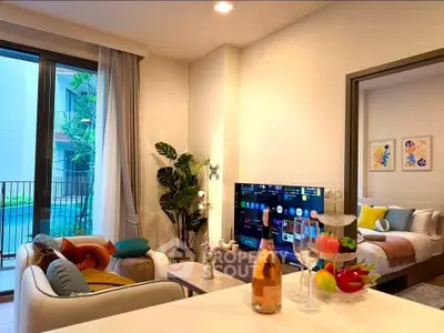 Modern living room with pool view, stylish decor, and cozy bedroom in luxury apartment.