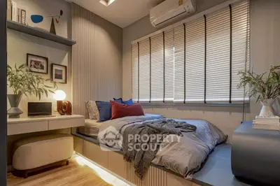 Cozy modern bedroom with stylish decor and natural light