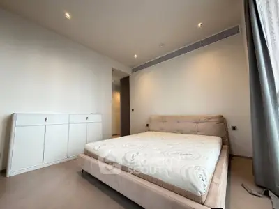 Spacious modern bedroom with minimalist design and natural light