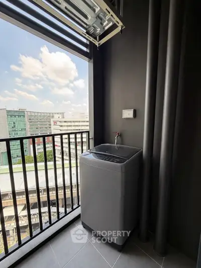 Modern balcony with washing machine and city view, perfect for urban living convenience.