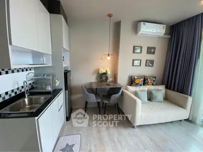 Modern compact living room with kitchenette and cozy dining area